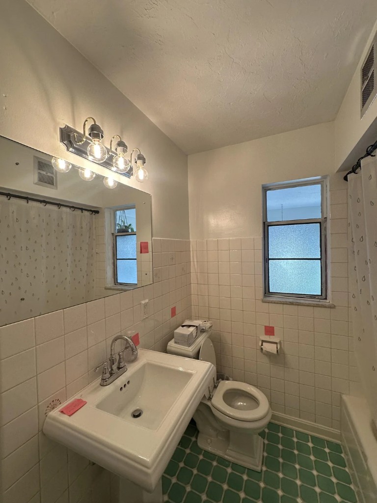 Original Bathroom photo before Transitional remodel plan
