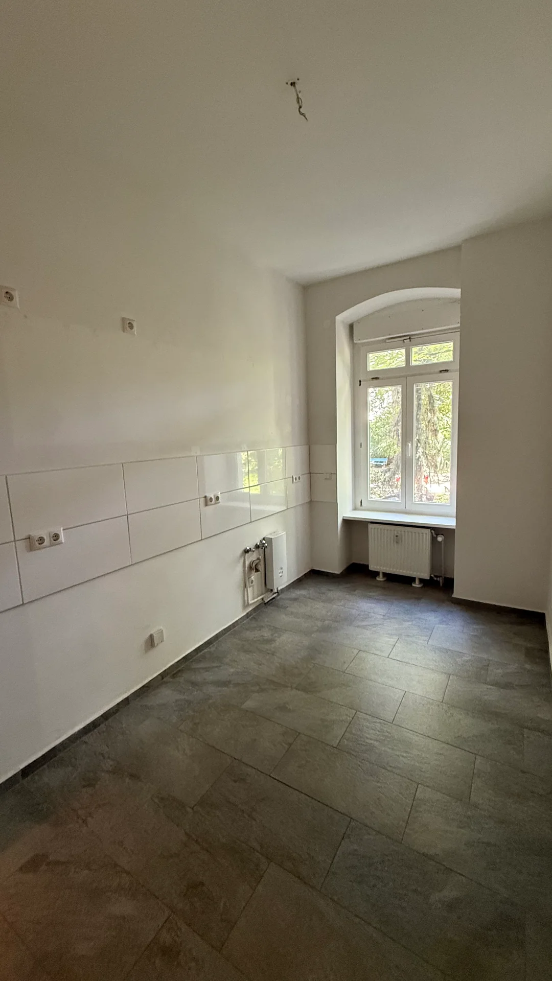 Original narrow kitchen photo before a Scandinavian cabinet and lighting redesign